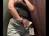Hot MILF masturbates in the fitting room of the store